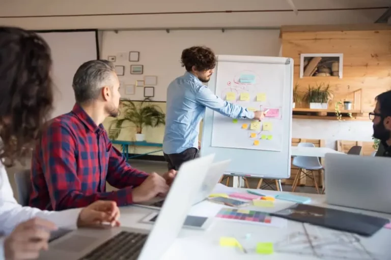 Man teaching in office