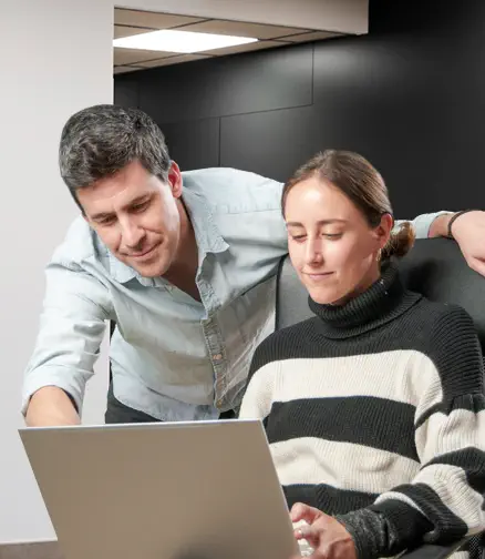 Man and woman in front of a computer