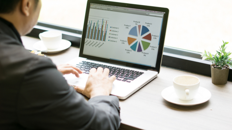 Man watching Excel office graph analysis