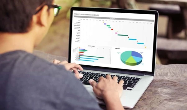 Person using risk matrix tool in Excel