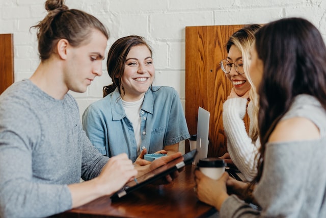 People talking and laughing in a good work environment.