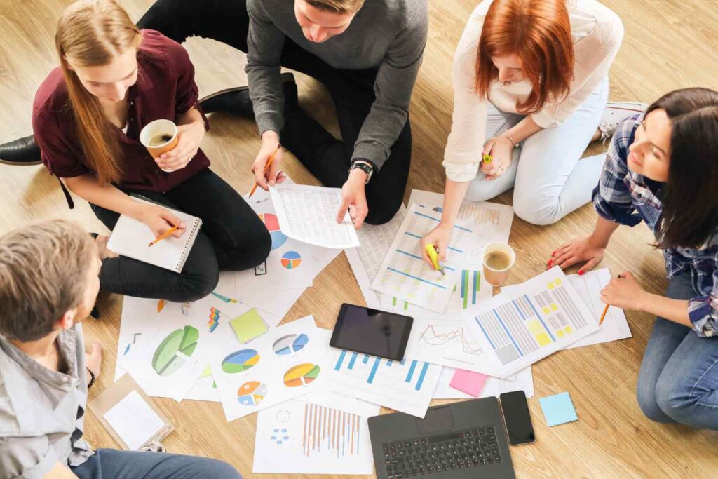 People in an office working and having fun as part of a practice in people management