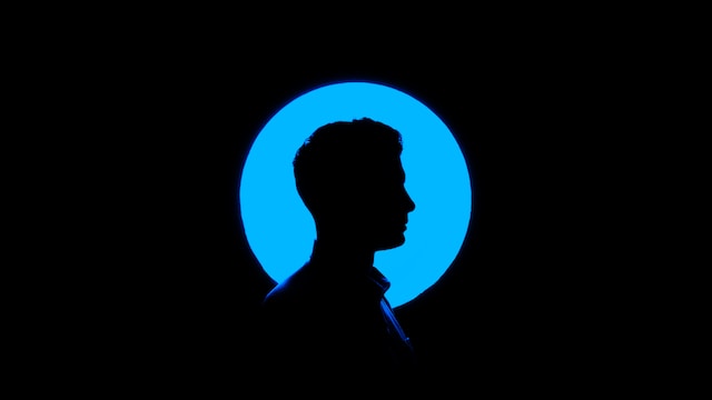 Profile of a person in a blue circle