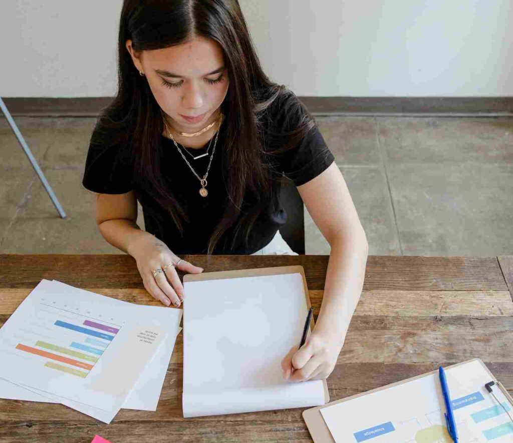 A woman is making a bar graph